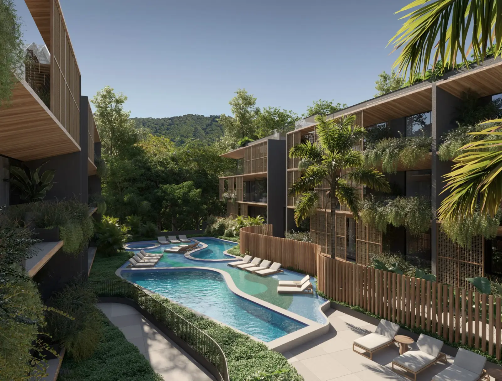 Piscina alongada entre as torres, cercada por vegetação