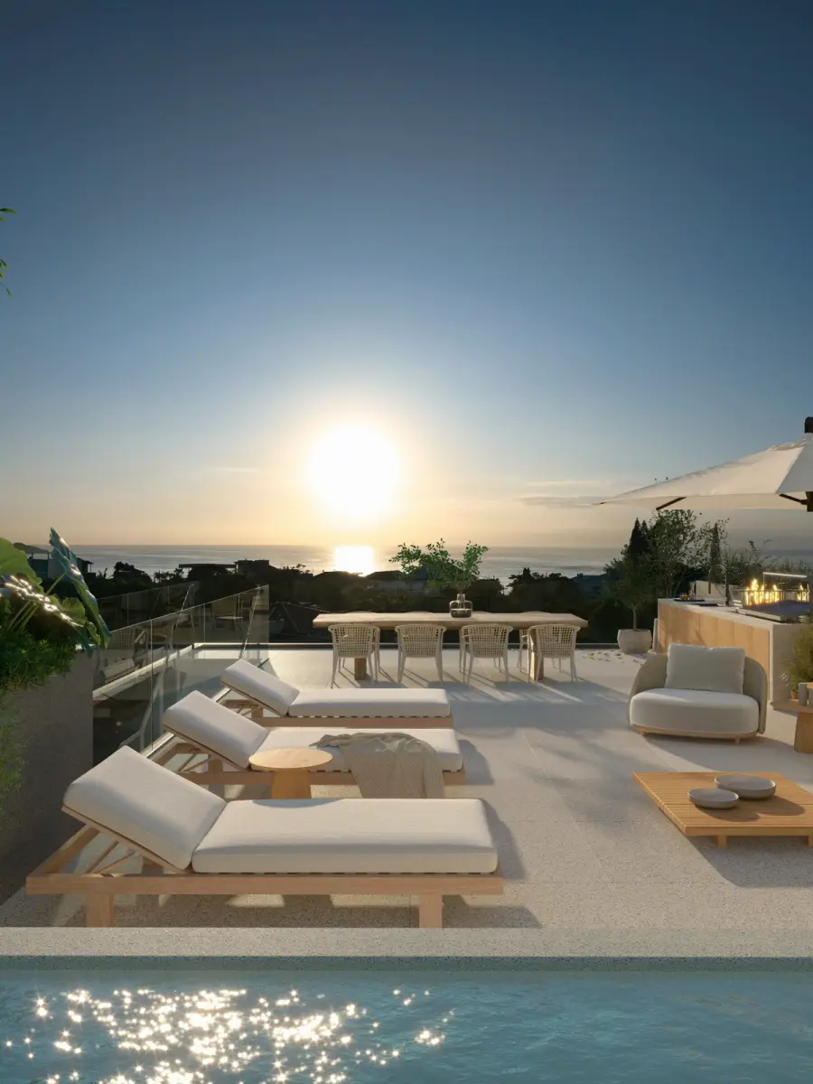 Rooftop privativo ao entardecer, com piscina e lounge voltados para o mar